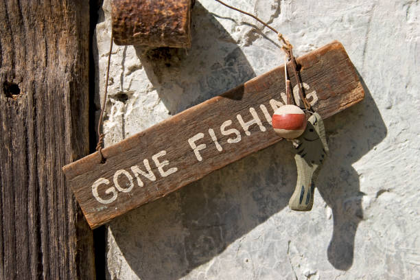 istock close up on gone fishing sign 98131600