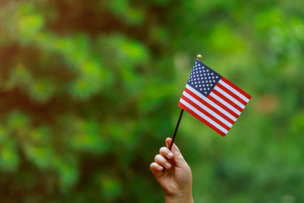 with american flag in her hand Independence Day, Flag Day concept