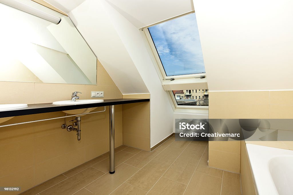 modern bathroom Photo of a modern bath room of a residential loft/penthouse with skylight window. Apartment Stock Photo