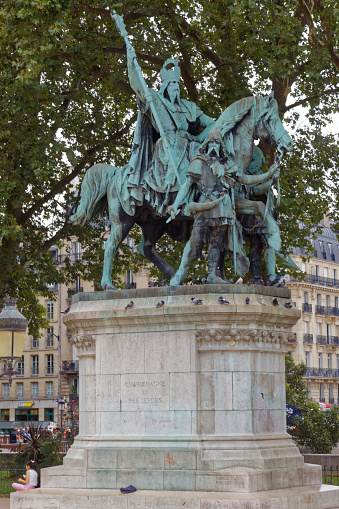 Paris - July 31, 2017: The statue of Charlemagne and his guards in the plaza of Notre Dame.