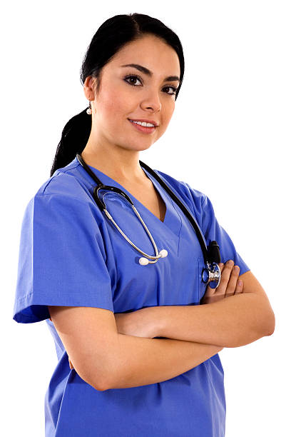 Female healthcare worker in blue scrubs Stock image of female healthcare worker over white background female nurse stock pictures, royalty-free photos & images