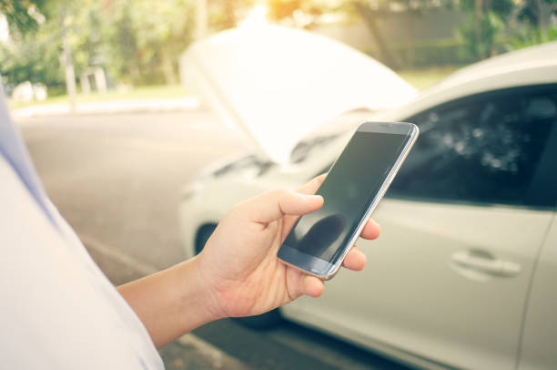 istock Asians use smart phones to get help after a broken down car. 981349802