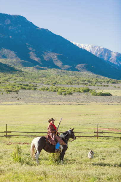 istock Cowboy sheriff with paint horse 981360526