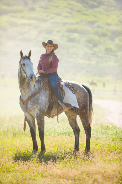 istock Cowgirl Horseback Riding 981360592