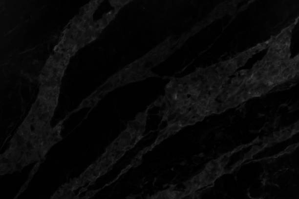 istock Abstract black marble background with natural motifs. 981371188