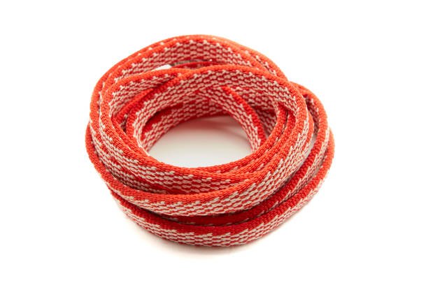 This rubber band was photographed on a white melamine table with a close-up shot.