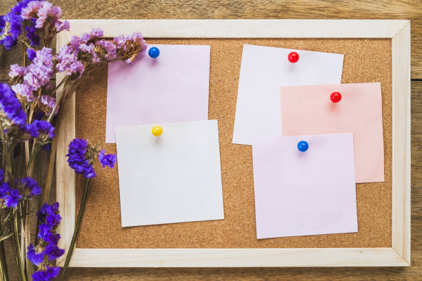istock Blank notes on the cork board with dry flower bouquet 981376622