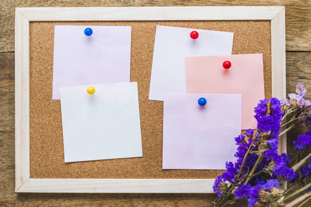 istock Blank notes on the cork board with dry flower bouquet 981379052