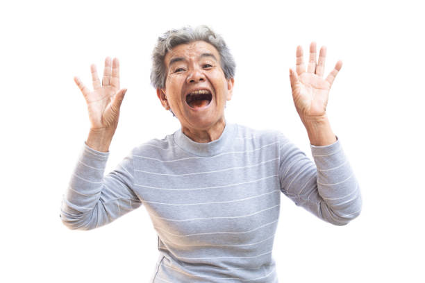 istock Happy Asian old woman joyful on white background 981384662