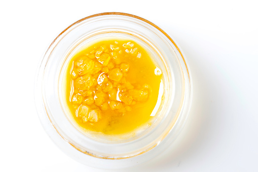 Premium Organic Cannabis Wax in Container on white background