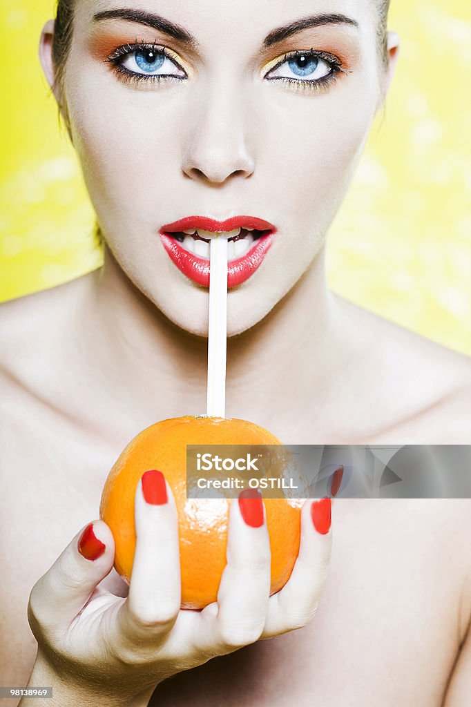 woman drinking orange juice  20-29 Years Stock Photo