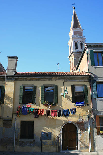 Venetian laundry hanging from a window stock photo