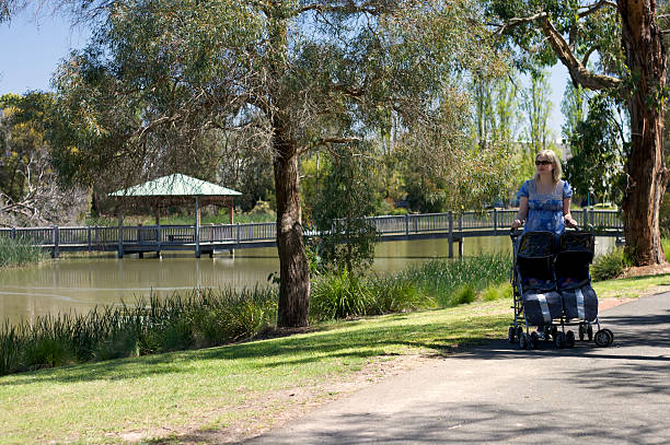 Mother and Twins at the Park stock photo