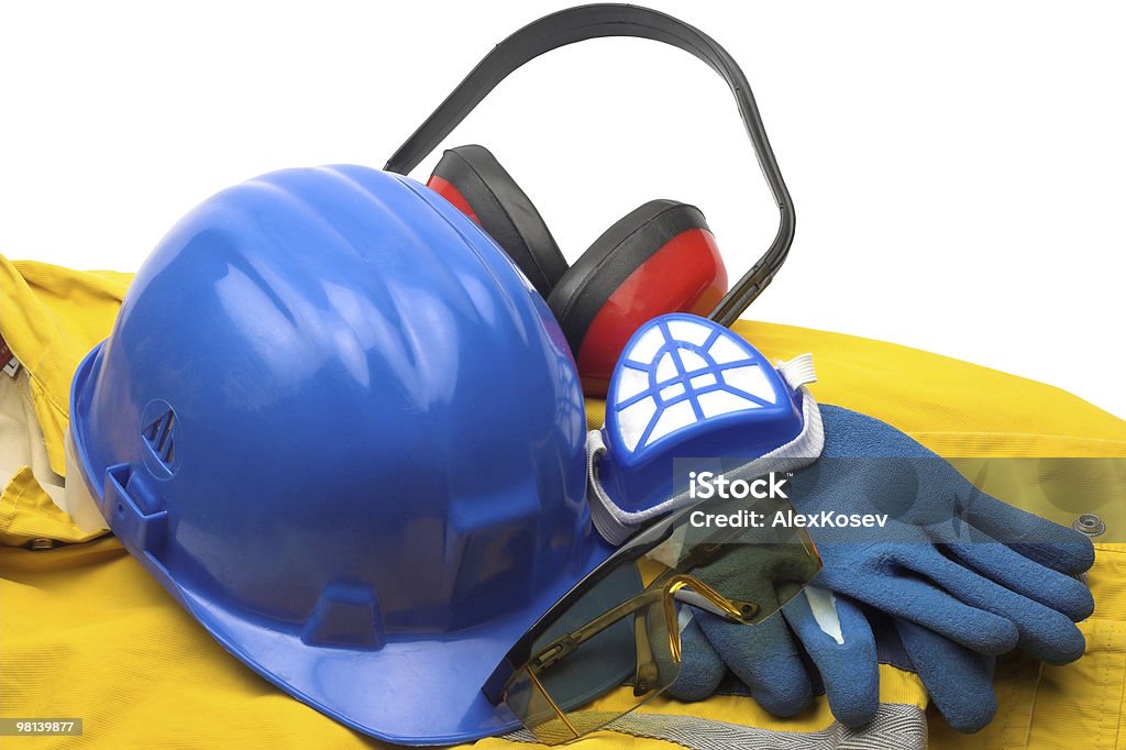 Blue, red and yellow safety equipment and uniform Safety gear kit and tools close up. Clothing Stock Photo