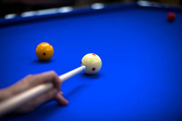 istock Billiards, billiard table. Targeting the cue in the ball for impact 981418528