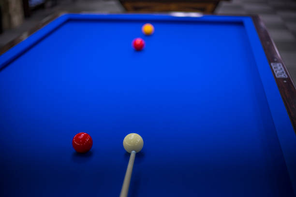 istock Billiards, billiard table. Targeting the cue in the ball for impact 981418580