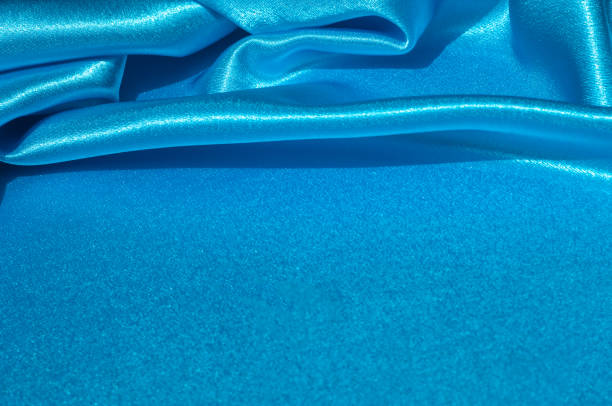 istock Texture, fabric, background. Abstract background of luxurious fabric or liquid waves or wavy grunge crease silk satin texture of velvet material or luxurious Christmas or elegant background. Blue 981418882