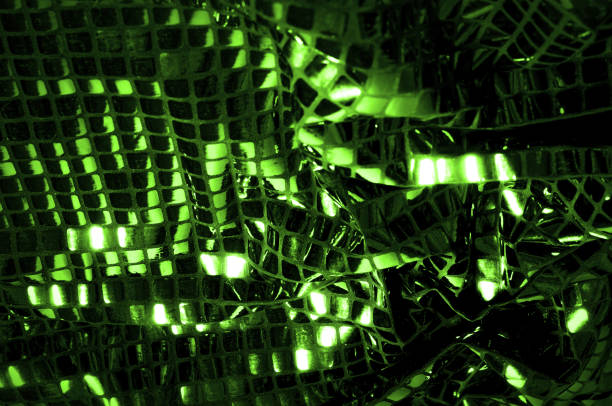 istock texture, background, pattern. Fabric with large paillettes made of green. Create a sharp look that is ready for attention with these multicolored oil stains of big sparkles. 981419012