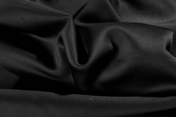 istock Texture. Background. Pattern. Black fabric for cutting clothes. Excellent evening dress, great design 981419086