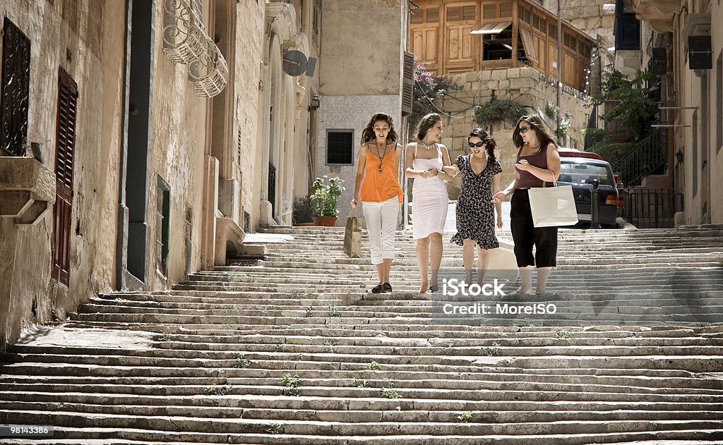 Four Girls With Shopping Bags, Urban Scene Four girls with shopping bags. Malta Stock Photo