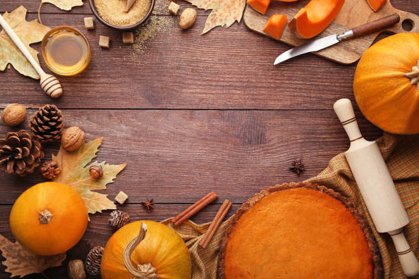 istock Pumpkin tart with honey, sugar, cinnamon and walnuts on wooden table 981434558
