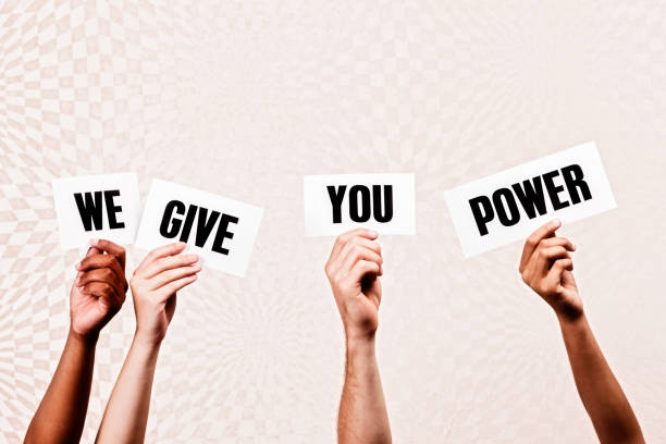 istock Four hands hold signs reading 