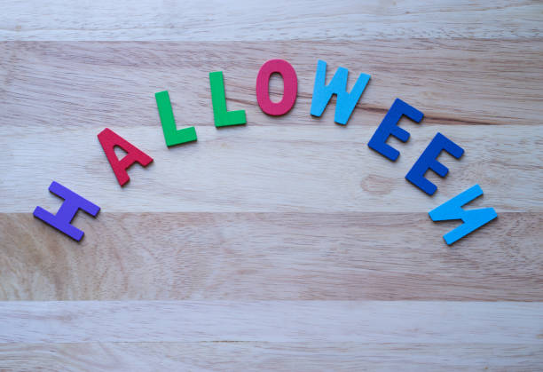 istock alphabet Halloween on wooden background, 981459074
