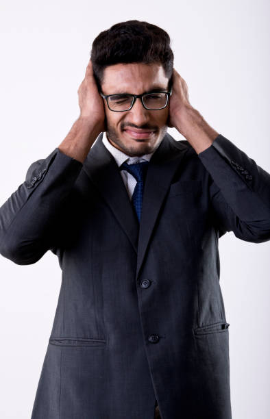 istock Irritated businessman covering his ear 981464120