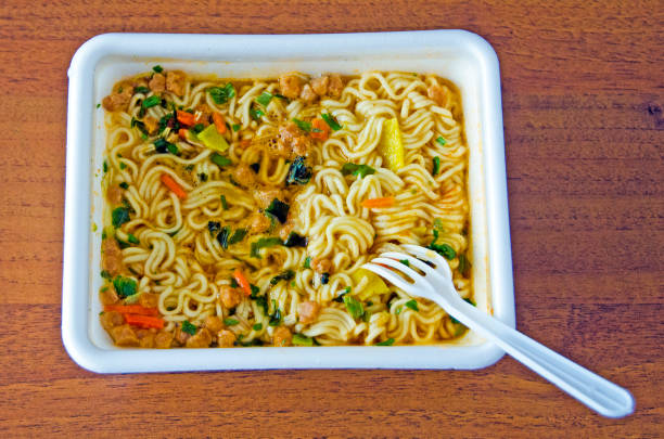 istock Appetizing instant noodles in a thermo-cup 981465244