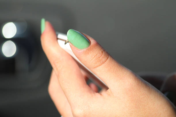 Close-up of a woman's hand using the phone. Woman using a smartphone