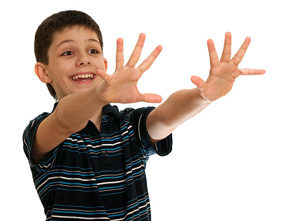 istock Spontaneous boy is stretching his hands towards an invisible aim 98147680