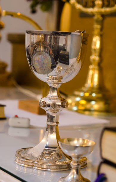 istock Mug in silver for supper in the church 981477926