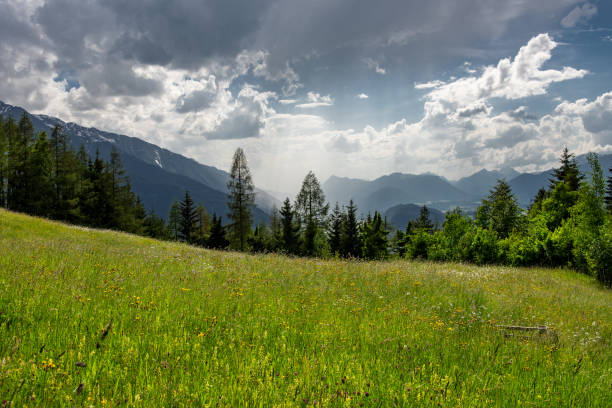 istock Burst of sunlight on mountains in the Austrian Alps 981482950
