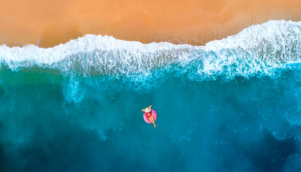 istock Swimming in clear turquoise sea 981489330