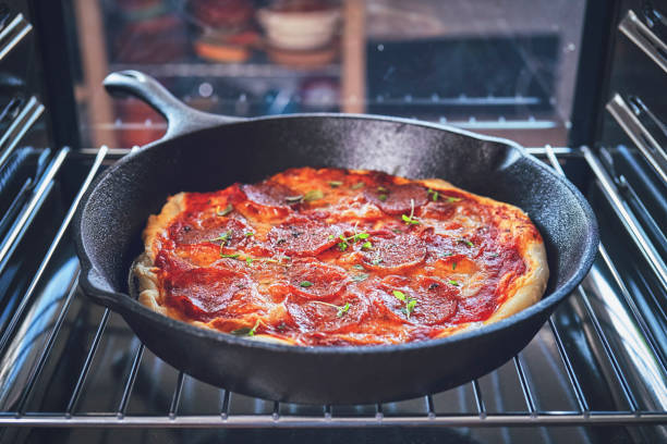 istock Baking Homemade Pizza in the Oven 981496510