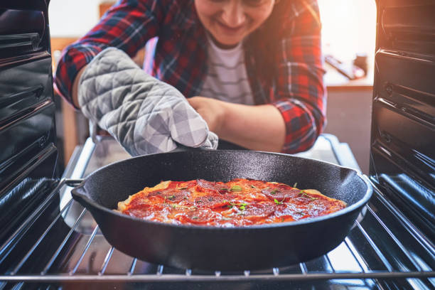 istock Baking Homemade Pizza in the Oven 981496524