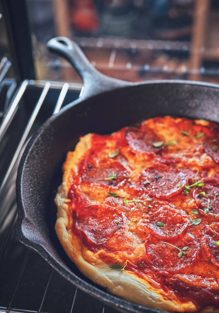 istock Baking Homemade Pizza in the Oven 981496526