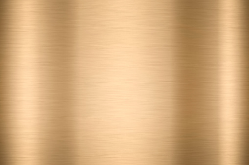 Abstract Shiny smooth foil metal Gold color background Bright vintage Brass plate chrome element texture concept simple bronze leaf panel hard backdrop design, light polished steel banner wallpaper.