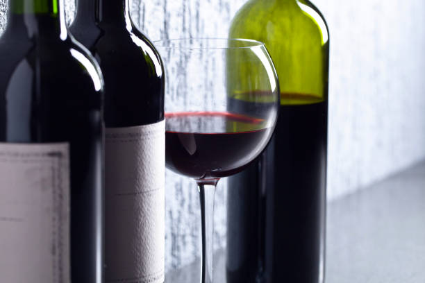 istock Bottles and glass of red wine . 981505418