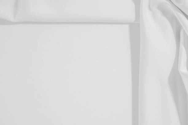 istock Texture. Background. Cloth - silk white. Delicate design in time for the season, take home this white swan. With its silky smooth hand and uplifting drapery, create soft silhouettes that boast of luxury 981505854