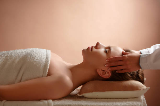 istock The masseuse makes relaxing head massage and spa client to young girl 981508468