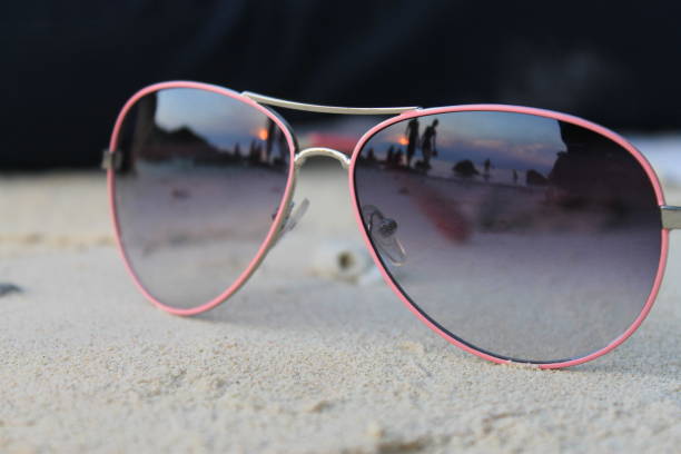 istock Sunset through the lens of sunglasses 981512172
