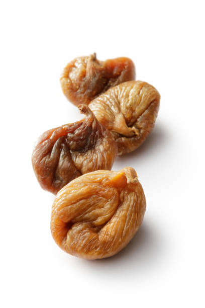 obst: getrocknete feige - dried fig brown color image dried food stock-fotos und bilder