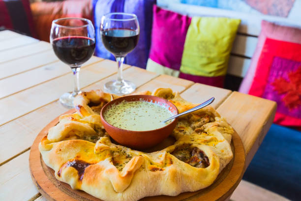 istock Traditional Georgian adjara pie and wine 981517220