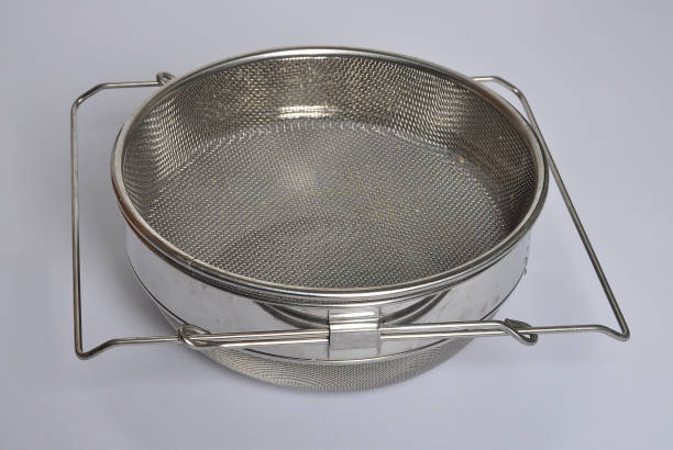 istock Honey sieve stainless steel on gray 981517528