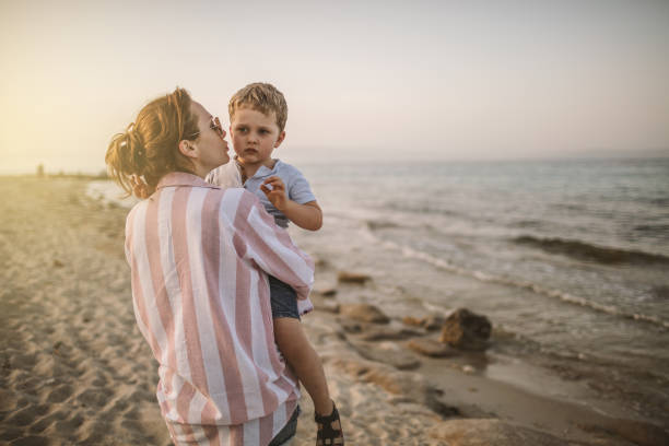 istock Mother and son at the beach 981525958
