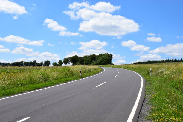 istock bend of a country road 981527148