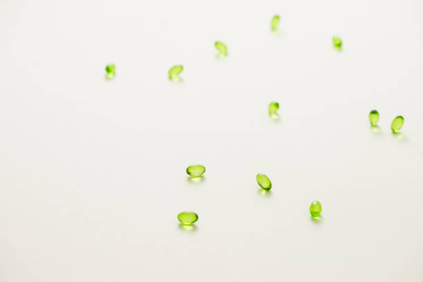 istock Top view many gel capsules on white background isolated. Vitamin E 200 mg capsules. 981527602
