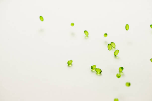 istock Top view many gel capsules on white background isolated. Vitamin E 200 mg capsules. 981527630
