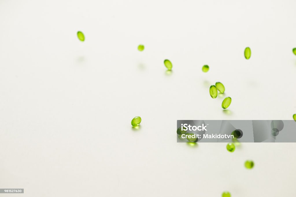 Top view many gel capsules on white background isolated. Vitamin E 200 mg capsules. Capsule - Medicine Stock Photo